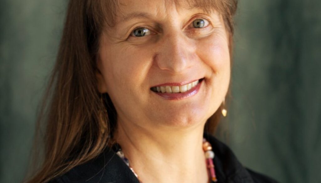 Smiling woman in a black blouse