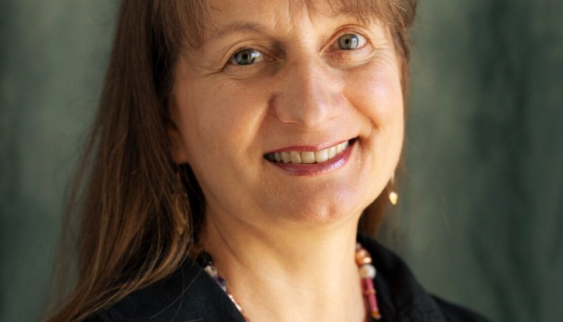 Smiling woman in a black blouse