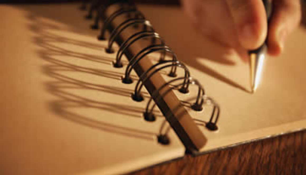 Hand writing in a spiral notebook